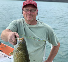 Captain Joe holding a perch