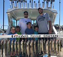kids and their dads with fish