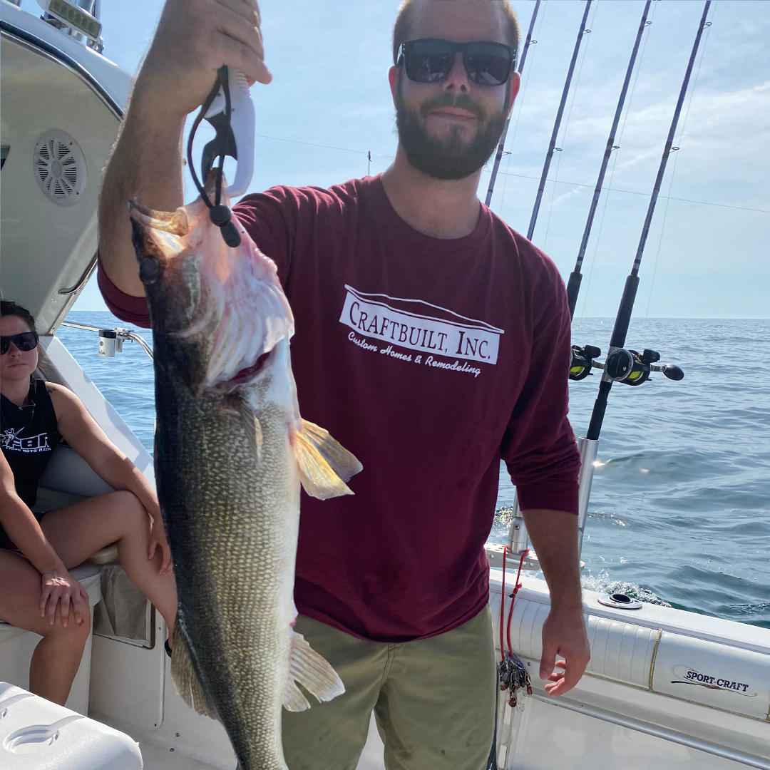 woman holding a big lake trout