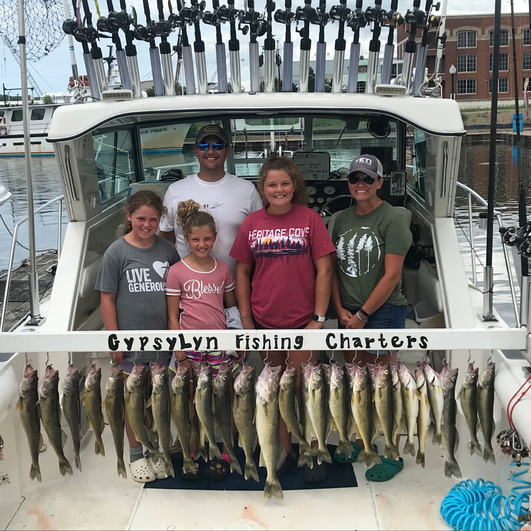 family with walleye catch
