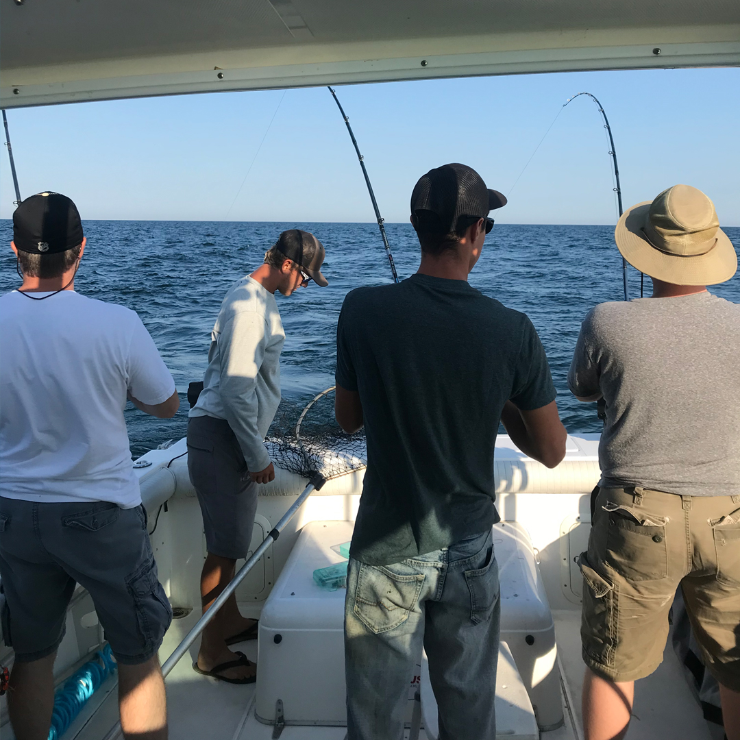 woman holding a big lake trout