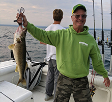 happy man holding his fish