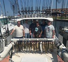 group of guys with their walleye and a steelhead