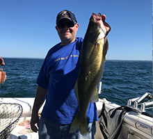 boy holding a big walleye