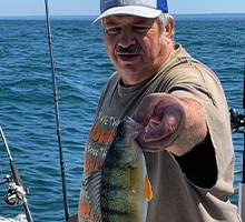 gentleman holding a huge perch