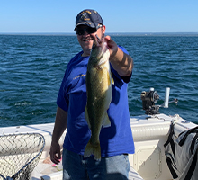 gentleman holding a walleye